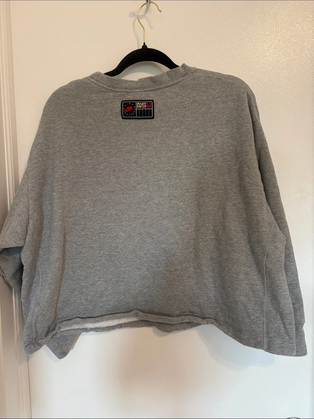 Nike Gray Crewneck Sweatshirt with White Swoosh and Yellow 'Sportswear' Text